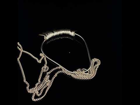 Video of Kokkino's Shimmer Hoop Silver & Yellow Gold Fringe Pendant. Available on DESIGNYARD.com and in our Contemporary Jewellery Shop Dublin, Ireland. Worldwide Shipping with DHL.