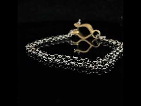 Video of Síne Vasquez's Contemporary 14k Yellow Gold Oxi Silver Ruby Hasi Bracelet. Available on DESIGNYARD.com and in our Jewellery Shop Dublin, Ireland. Free Worldwide Shipping with DHL.