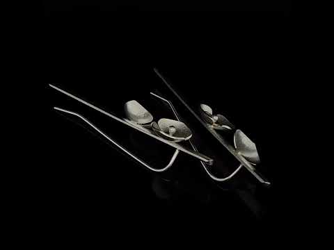 Video of Inga Reed's Contemporary Sterling Silver 22k Yellow Gold Two Orchid Earrings. Available on DESIGNYARD.com and in our Jewelry Store Dublin, Ireland.