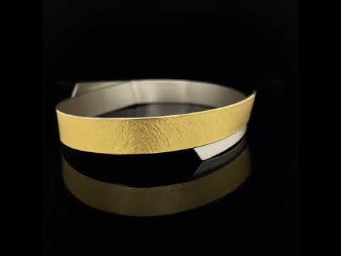 Video of Manu's Contemporary Sterling Silver 22k Yellow Gold Layered Bangle. Available on DESIGNYARD.com and in our Jewellery Shop Dublin, Ireland. Free Worldwide Shipping with DHL.