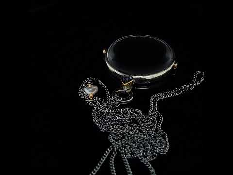 Video of Josephine Bergsøe's  Silver & Yellow Gold Bonoculo Pearl Blue Sapphire Diamond Necklace. Available on DESIGNYARD.com and in our Contemporary Jewellery Shop Dublin, Ireland. Free Worldwide Shipping with DHL.