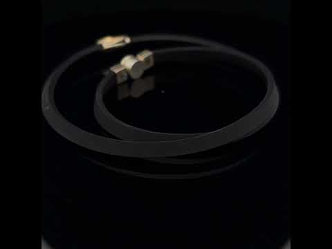 Video of Manu's Contemporary Silver 22k Yellow Gold Swirls Diamond Rubber Necklace. Available on DESIGNYARD.com and in our Jewellery Shop Dublin, Ireland. Free Worldwide Shipping with DHL.