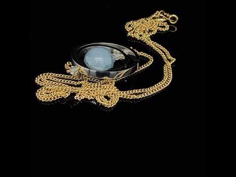 Video of Nicole Van Der Wolf's Contemporary Yellow Gold Silver Aquamarine Ice Rink Double Axle Necklace. Available on DESIGNYARD.com and in our Jewellery Shop Dublin, Ireland. Free Worldwide Shipping with DHL.