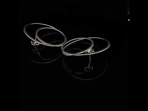 Video of Latham & Neve's Contemporary Sterling Silver Gyra Hoop Statement Earrings. Available on DESIGNYARD.com and in our Jewellery Shop Dublin, Ireland. Worldwide Shipping with DHL.