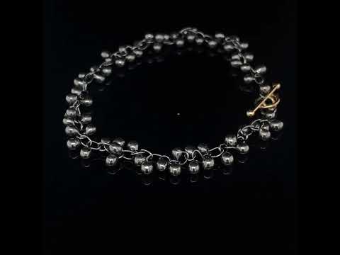 Video of Neeltje Huddleston Slater's Contemporary Fine Oxidized Silver 14k Yellow Gold Beaded Bracelet. Available on DESIGNYARD.com and in our Jewellery Shop Dublin, Ireland. Free Worldwide Shipping with DHL.