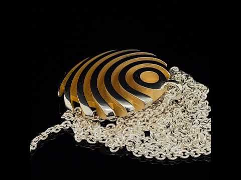 Video of Sarah Herriot's Sterling Silver & Gold Fish Button Statement Pendant. Available on DESIGNYARD.com and in our Contemporary Jewellery Shop Dublin, Ireland. Free Worldwide Shipping with DHL.