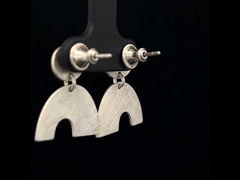 Video of Louise O'Neill's Contemporary Sterling Silver Calder Earrings. Available on DESIGNYARD.com and in our Jewellery Shop Dublin, Ireland. Free Worldwide Shipping with DHL.