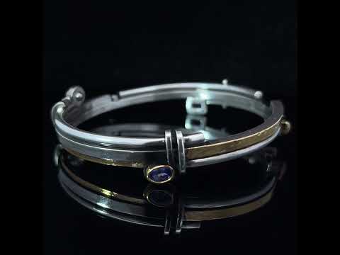 Video of Barbara Bertagnolli's Contemporary 24k Yellow Gold & Silver Tanzanite Moonstone Labradorite Statement Bangle. Available on DESIGNYARD.com and in our Jewellery Shop Dublin, Ireland. Free Worldwide Shipping with DHL.