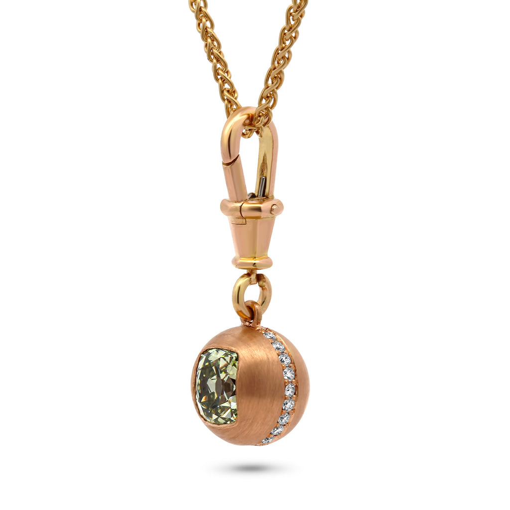 Photograph 2 of Sam Lafford's 18k Yellow Gold An Grá Green Diamond Pendant. Available on DESIGNYARD.com and in our Contemporary Jewellery Shop Dublin, Ireland. Number 1 for Contemporary Jewellery in Dublin.