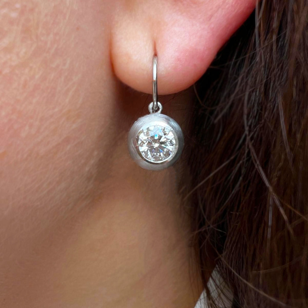 Photograph 2 of Sam Lafford's Platinum An Grá Diamond Earrings. Available on DESIGNYARD.com and in our Contemporary Jewellery Shop Dublin, Ireland. Free Worldwide Shipping with DHL.
