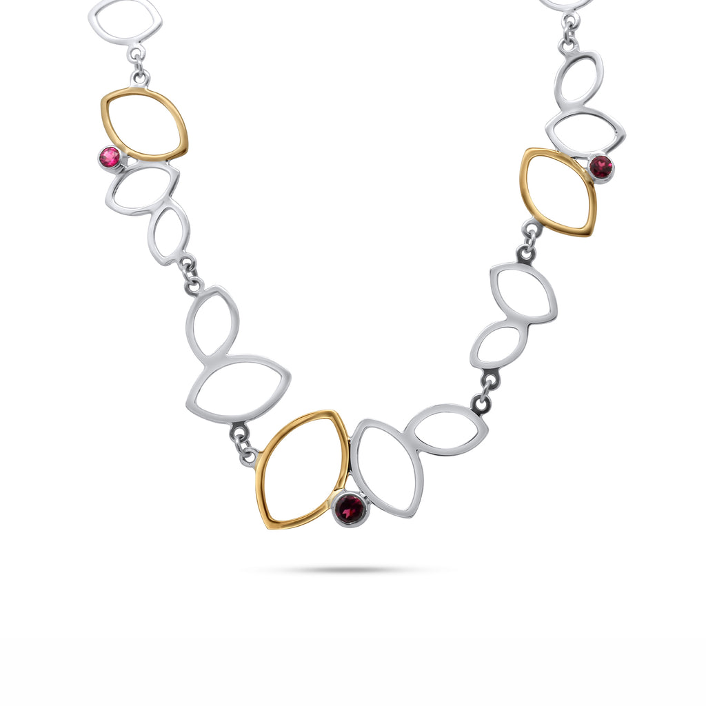 Photograph 1 of Stephanie Robinson's Sterling Silver & 14k Yellow Gold Falling Leaves Necklace. Available on DESIGNYARD.com and in our Contemporary Jewellery Shop Dublin, Ireland. Free Worldwide Shipping with DHL.
