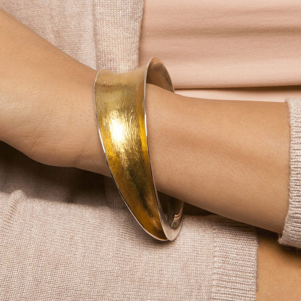 Photograph 2 of Seamus Gill's Contemporary 22k Yellow Gold Silver Flowing Statement Bracelet. Available on DESIGNYARD.com Dublin Ireland. Free Worldwide Shipping with DHL. 