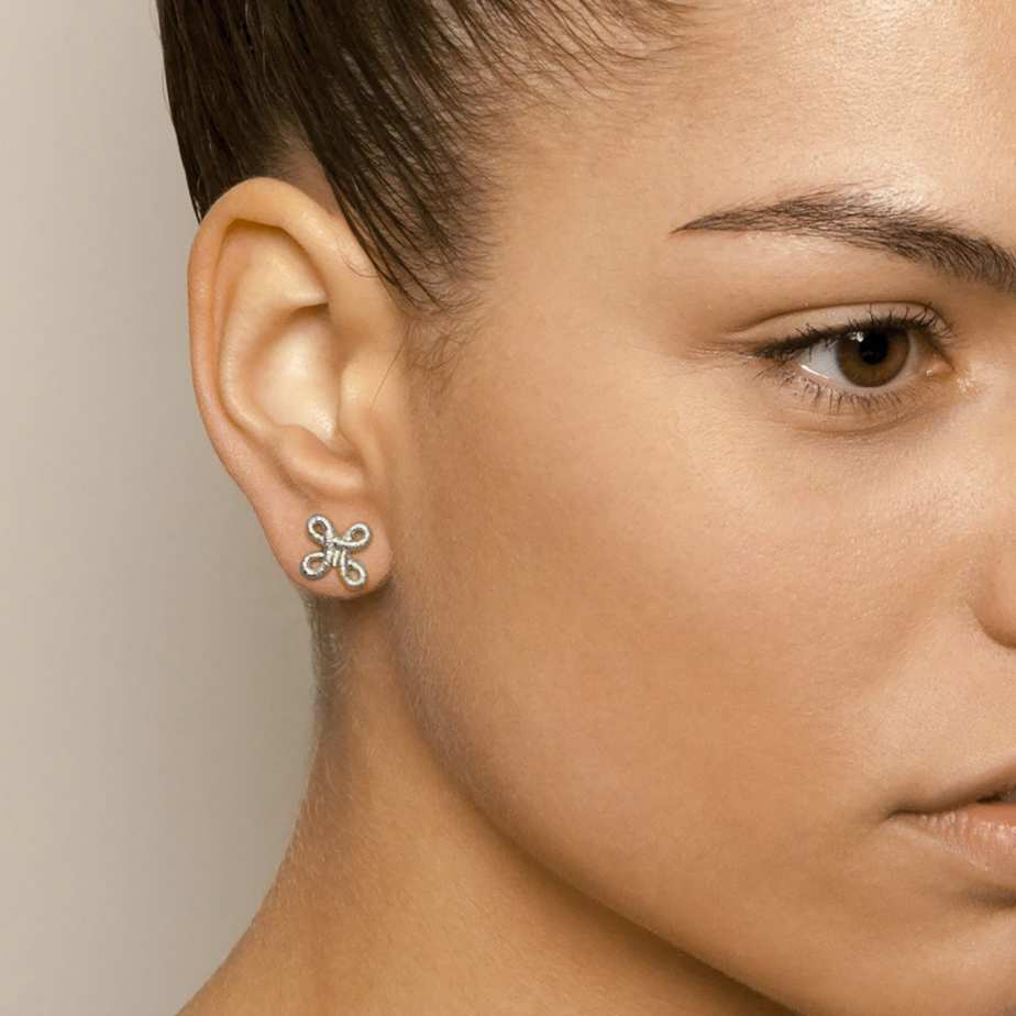 Photograph 2 of Brigitte Adolph's Sterling Silver Pique Dame Stud Dainty Earrings. Available on DESIGNYARD.com #1 for Contemporary Jewellery Dublin, Ireland. Shipping Worldwide.