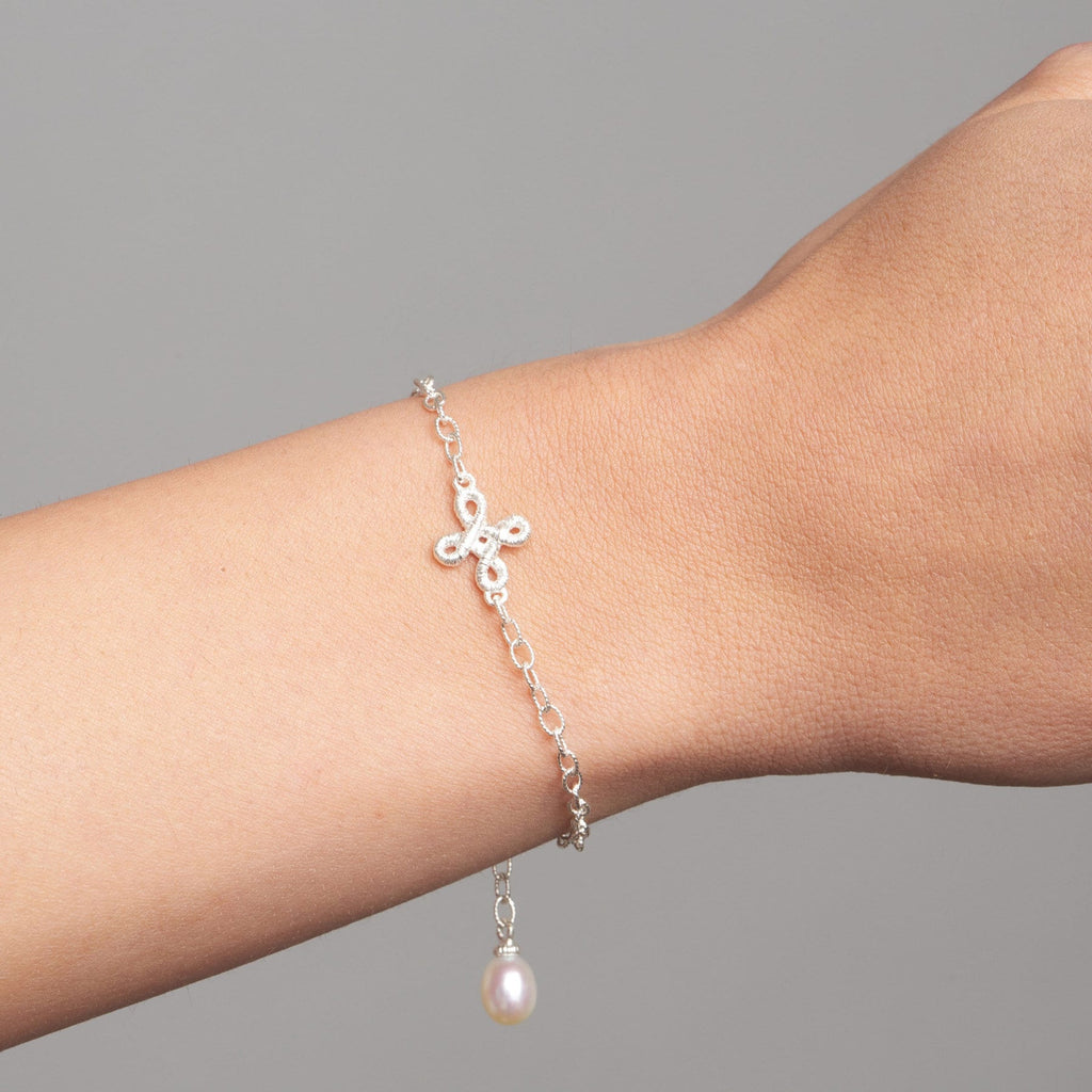 Photograph 1 of Brigitte Adolph's Sterling Silver Freshwater Pearl Pique Dame Dainty Delicate Bracelet. Available on DESIGNYARD.com No 1 for Contemporary Jewellery Dublin, Ireland.