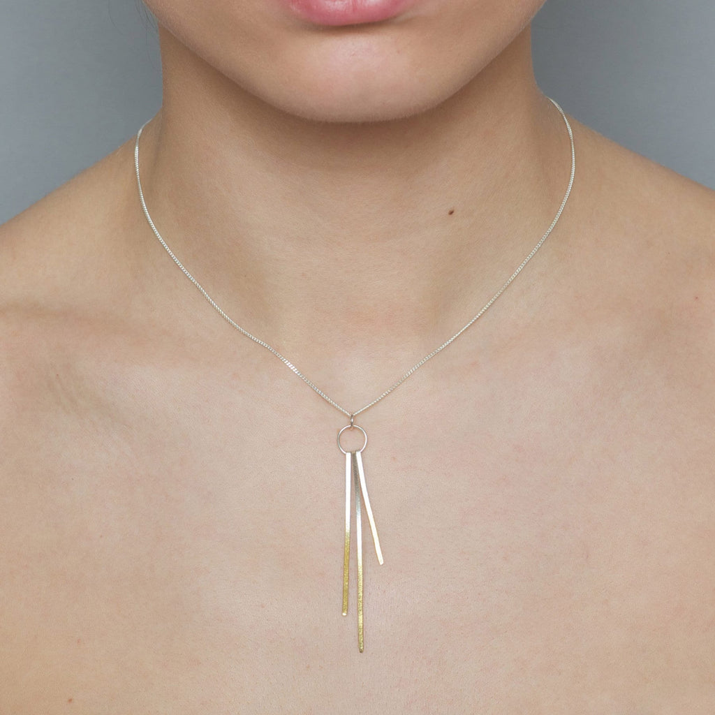 Photograph 2 of Kokkino's Contemporary Shimmer Triple Silver 24k Yellow Gold Necklace. Available on DESIGNYARD.com and in our Jewellery Shop Dublin, Ireland. Shipping Worldwide with DHL.