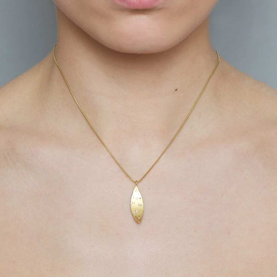 Photograph 2 of Kate Smith's Contemporary 18k Yellow Gold Scattered Diamond Curved Statement Necklace. Available on DESIGNYARD.com and in our Jewellery Shop Dublin, Ireland. Free Worldwide Shipping with DHL.