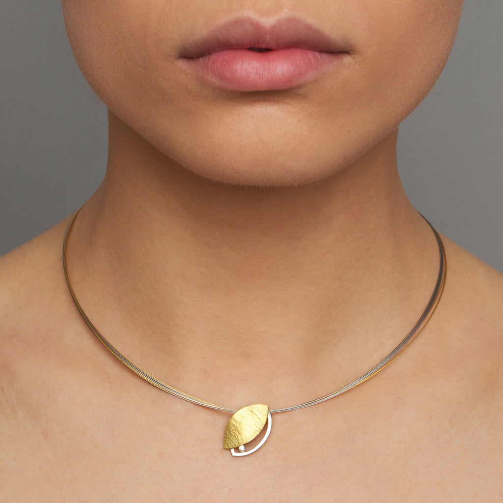 Photograph 2 of Manu's Contemporary 22k Yellow Gold BiMetal Sterling Silver Diamond Leaf Necklace. Available on DESIGNYARD.com and in our Jewelry Store Dublin, Ireland. Free Worldwide Shipping with DHL.