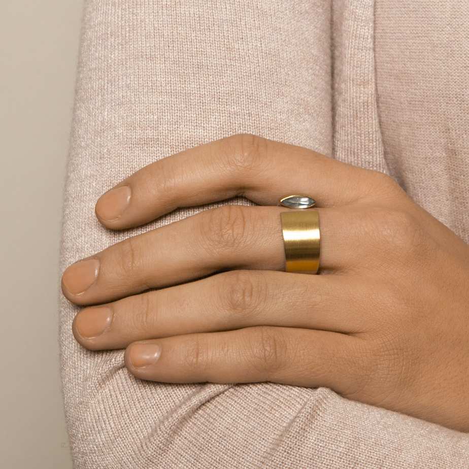 Photograph 2 of Manu's Contemporary Sterling Silver 22k Yellow Gold Navette Blue Topaz Open Band Ring. Available on DESIGNYARD.com and in our Jewellery Shop Dublin, Ireland.