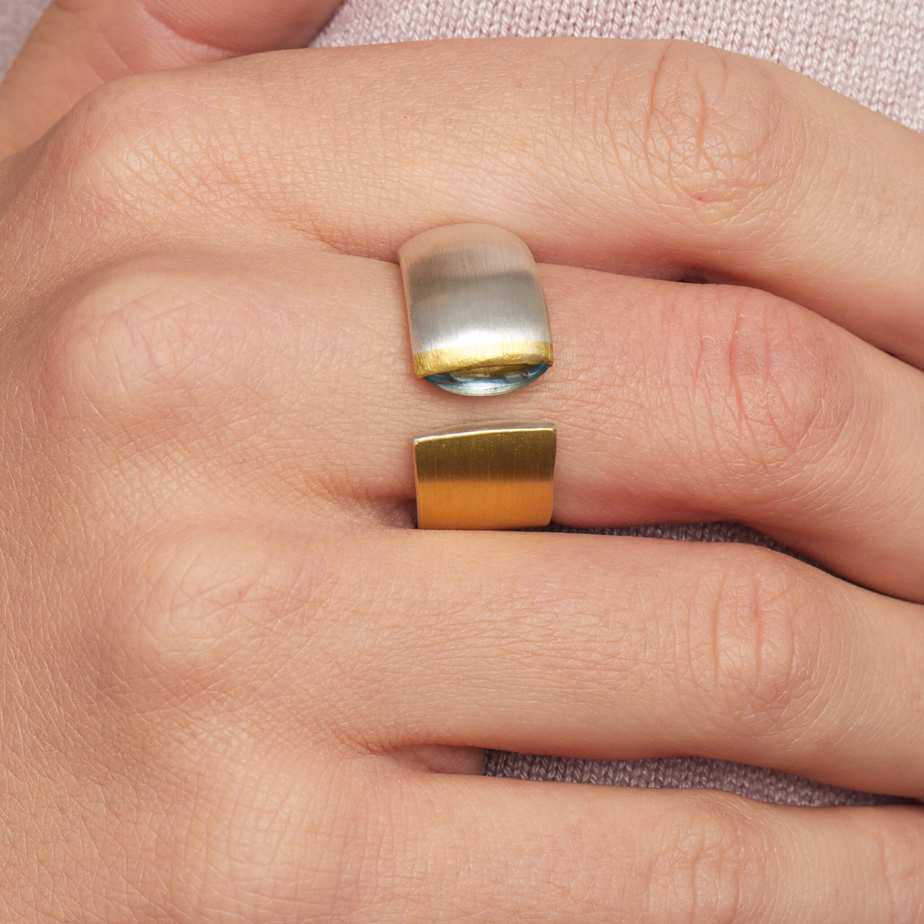Photograph 4 of Manu's Contemporary Sterling Silver 22k Yellow Gold Navette Blue Topaz Open Band Ring. Available on DESIGNYARD.com and in our Jewellery Shop Dublin, Ireland.