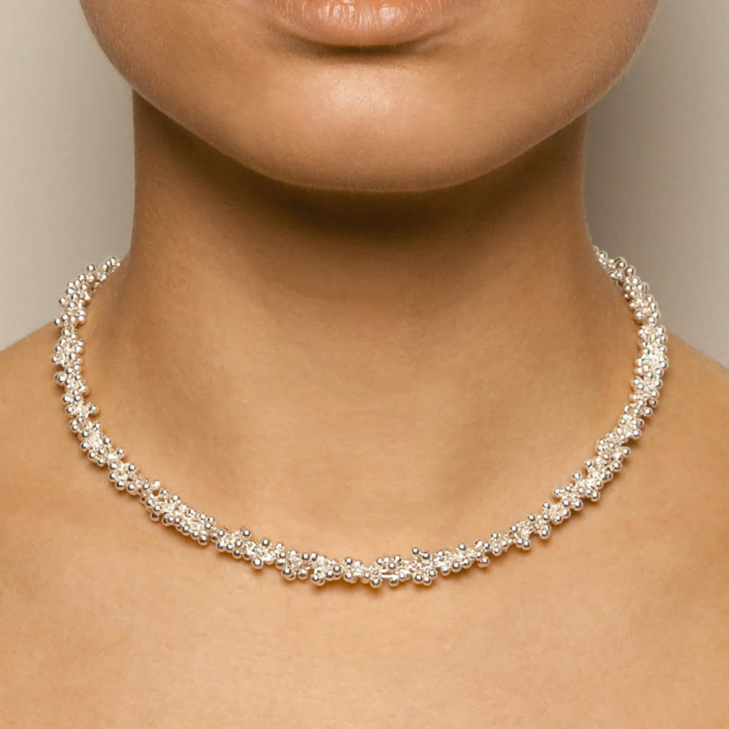 Photograph 4 Neeltje Huddleston Slater's 14k Yellow Gold T-Bar Clasp Double Silver Necklace. Available on DESIGNYARD.com and in Contemporary Jewellery Shop Dublin, Ireland. #1 for Contemporary Jewellery.