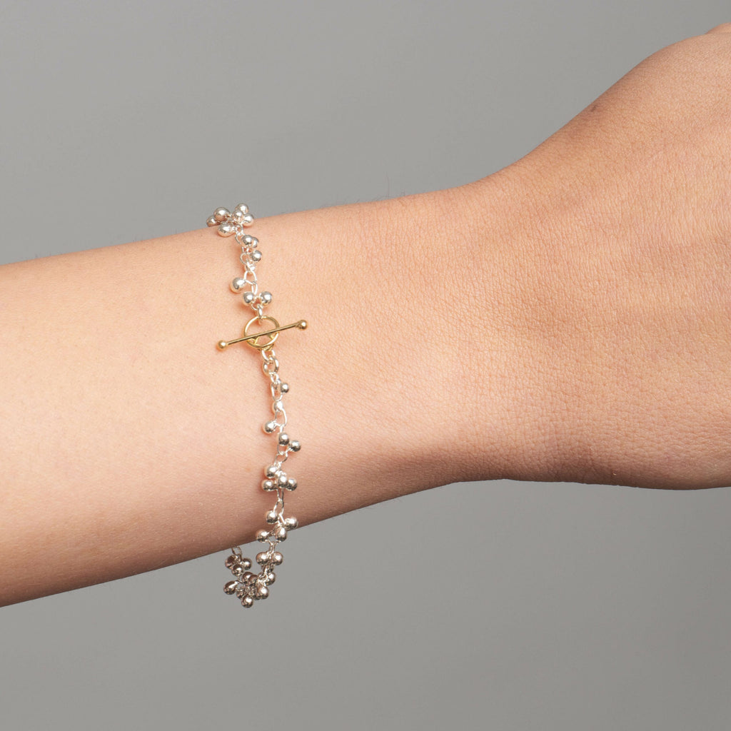 Photograph 2 of Neeltje Huddleston Slater's Contemporary Fine Silver & 14k Yellow Gold Beaded Bracelet. Available on DESIGNYARD.com and in our Jewellery Shop Dublin, Ireland. Free Worldwide Shipping with DHL.