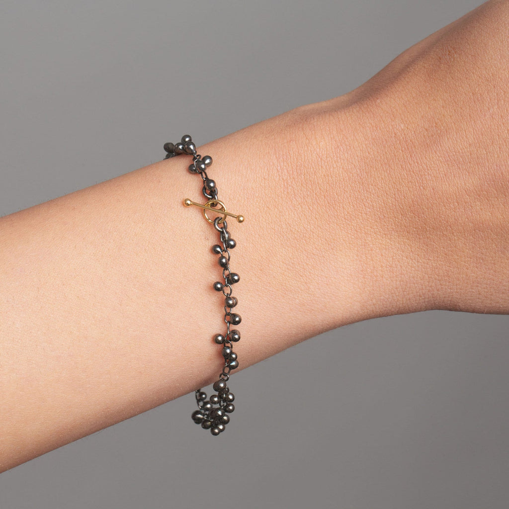 Photograph 2 of Neeltje Huddleston Slater's Contemporary Fine Oxidized Silver 14k Yellow Gold Beaded Bracelet. Available on DESIGNYARD.com and in our Jewellery Shop Dublin, Ireland. Free Worldwide Shipping with DHL.