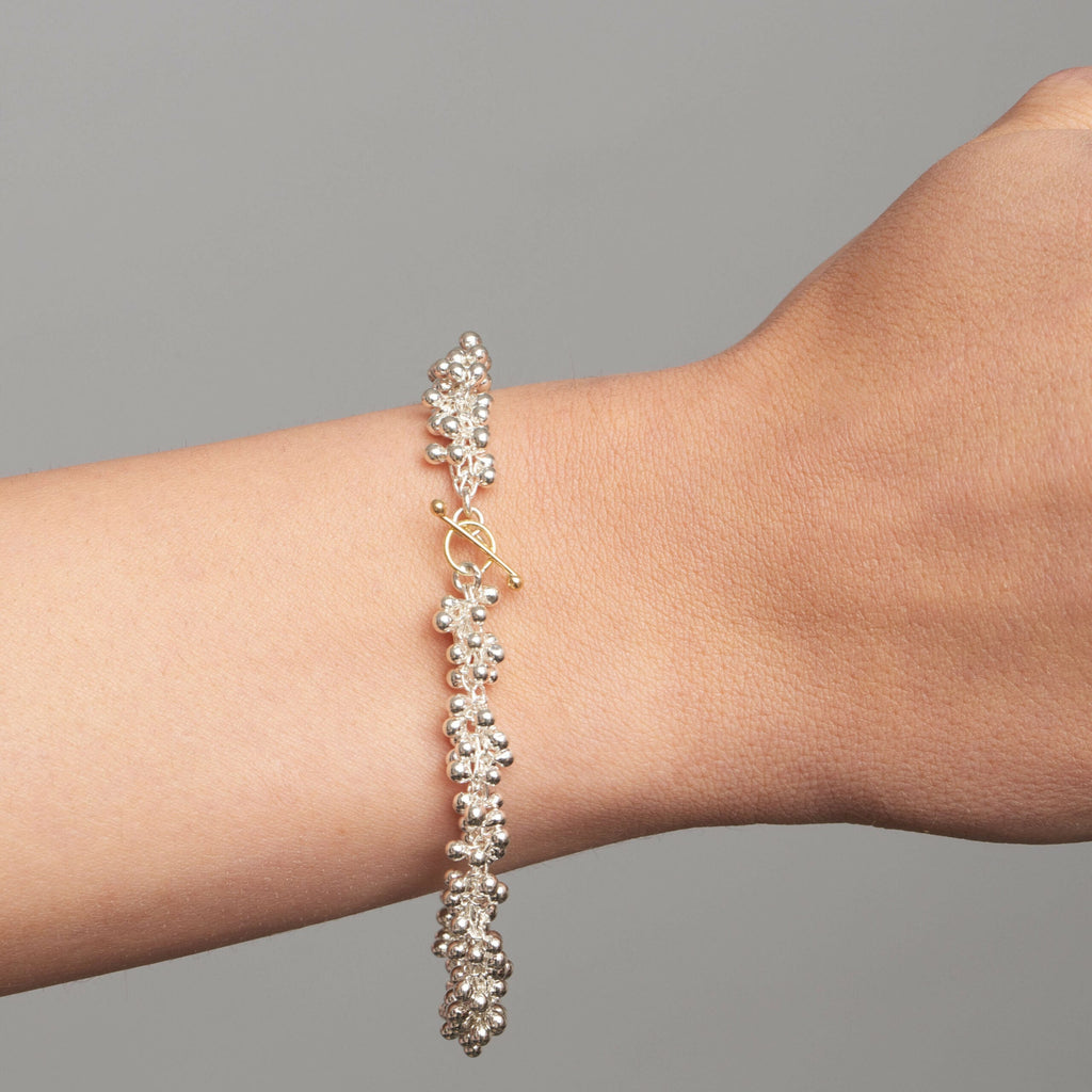 Photograph 2 of Neeltje Huddleston Slater's Contemporary Fine Silver 14k Yellow Gold Double Beaded Bracelet. Available on DESIGNYARD.com and in our Jewellery Shop Dublin, Ireland. Free Worldwide Shipping with DHL.
