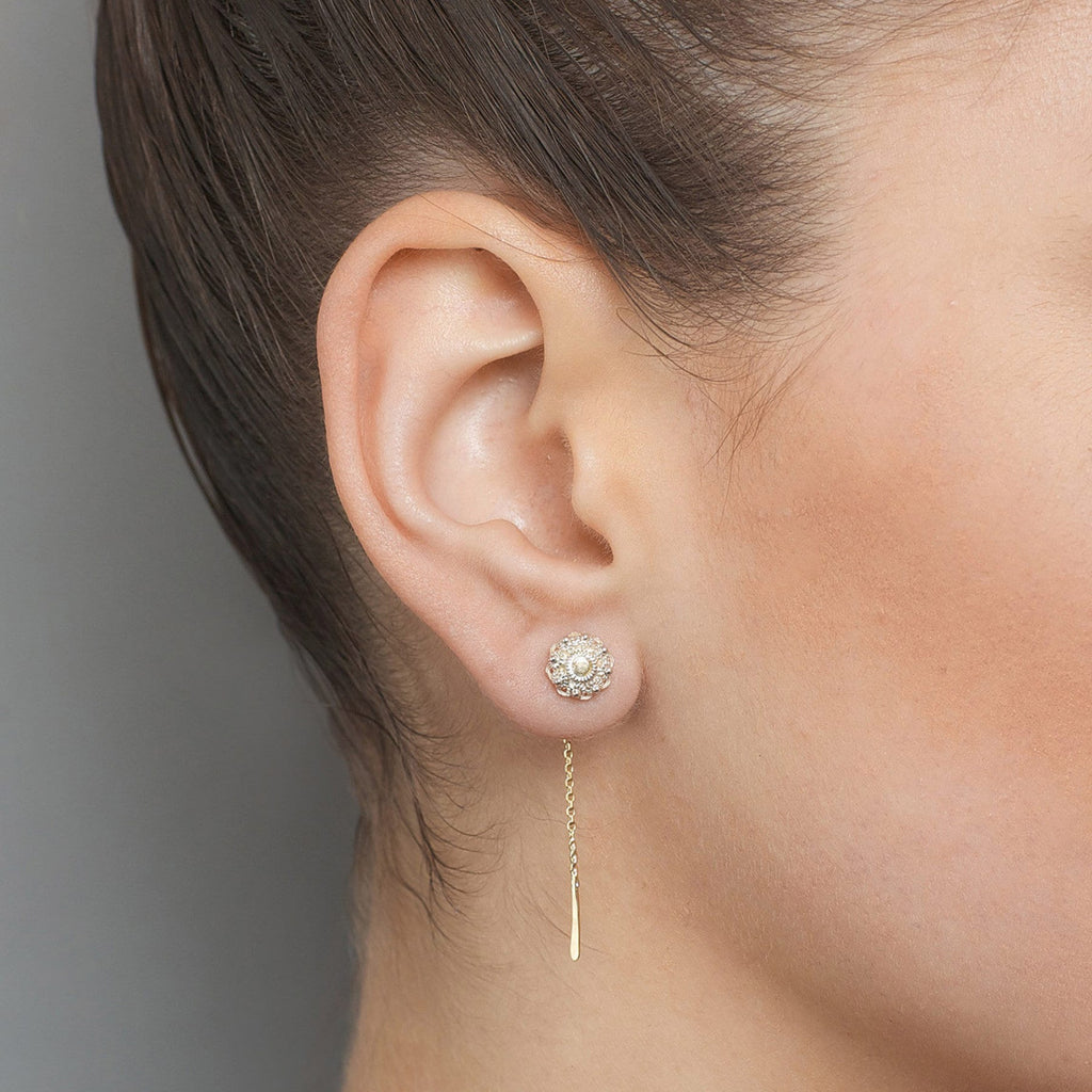 Photograph 2 of Neeltje Huddleston Slater's Sterling Silver & 14k Yellow Gold Zeeland Button Earrings. Available on DESIGNYARD.com and in our Contemporary Jewellery Shop Dublin, Ireland. #1 for Contemporary Jewellery.