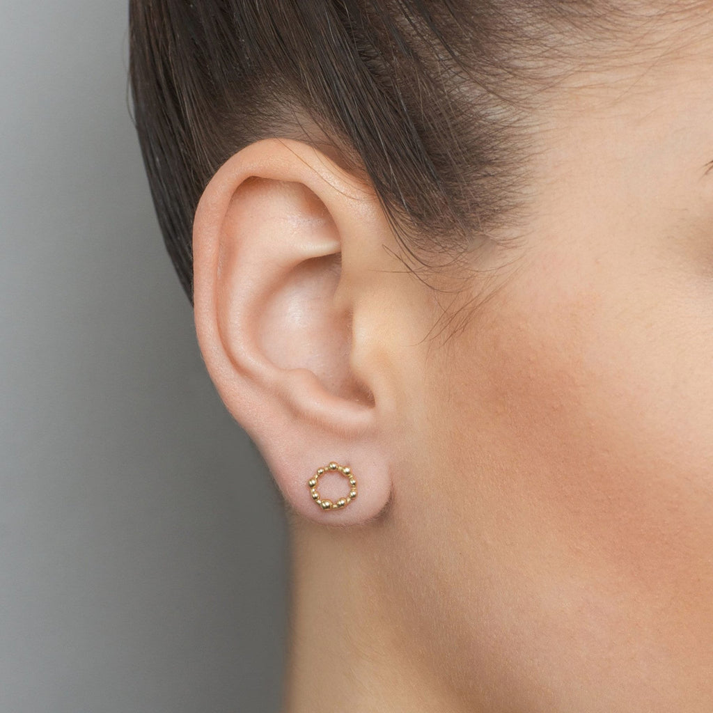 Photograph 2 of Neeltje Huddleston Slater's 14k Yellow Gold Circle Dot Earring. Available on DESIGNYARD.com and in our Contemporary Jewellery Shop Dublin, Ireland. #1 for Contemporary Jewellery.