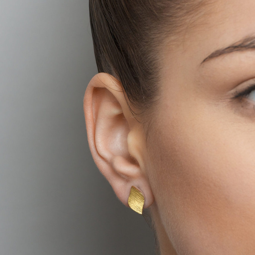 Photograph 1 of Seamus Gill's Contemporary 22k Yellow Gold Silver Flowing Curves Small Leaf Stud Earrings. Available on DESIGNYARD.com and in our Jewellery Shop Dublin, Ireland. Worldwide Shipping with DHL.