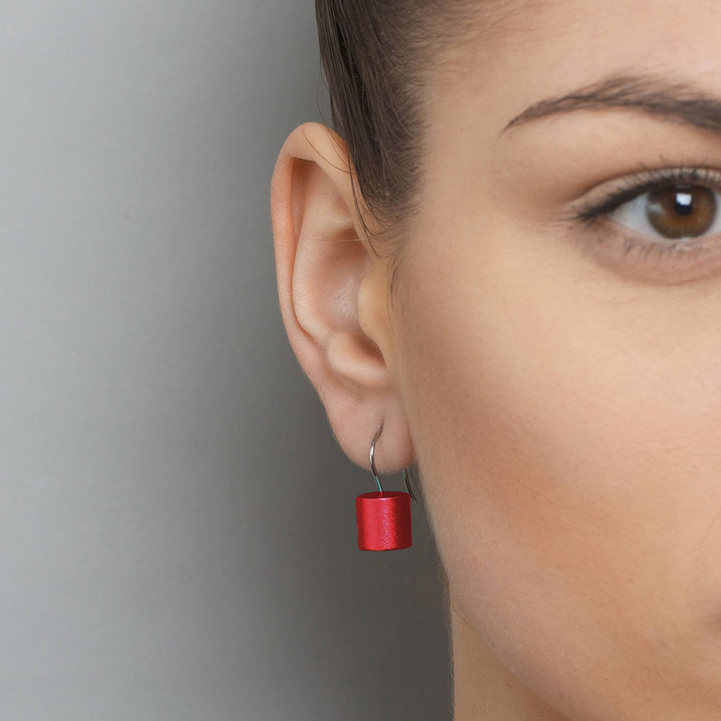 Photograph 2 of Ursula Muller's Contemporary Red Aluminium Roller Earrings. Available on DESIGNYARD.com and in our Jewellery Shop Dublin, Ireland. Worldwide Shipping with DHL.