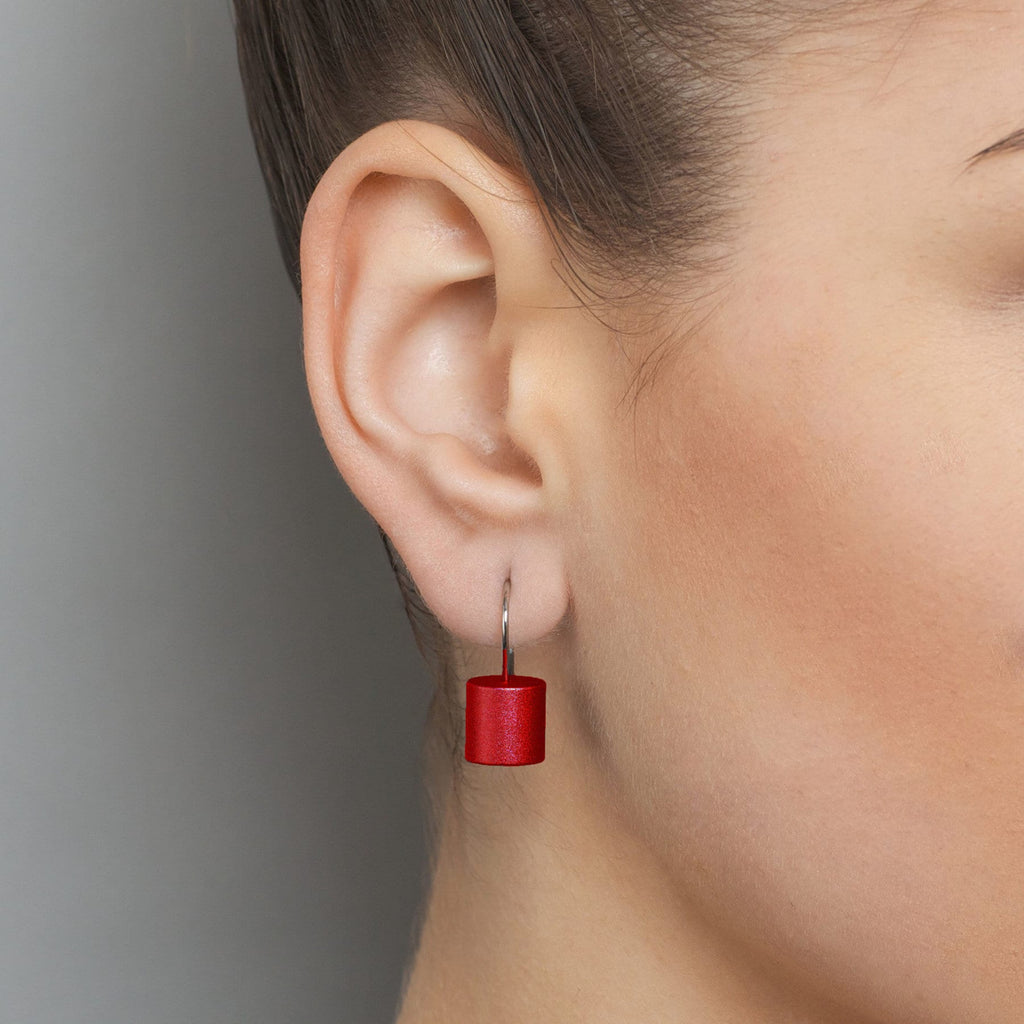 Photograph 3 of Ursula Muller's Contemporary Red Aluminium Roller Earrings. Available on DESIGNYARD.com and in our Jewellery Shop Dublin, Ireland. Worldwide Shipping with DHL.