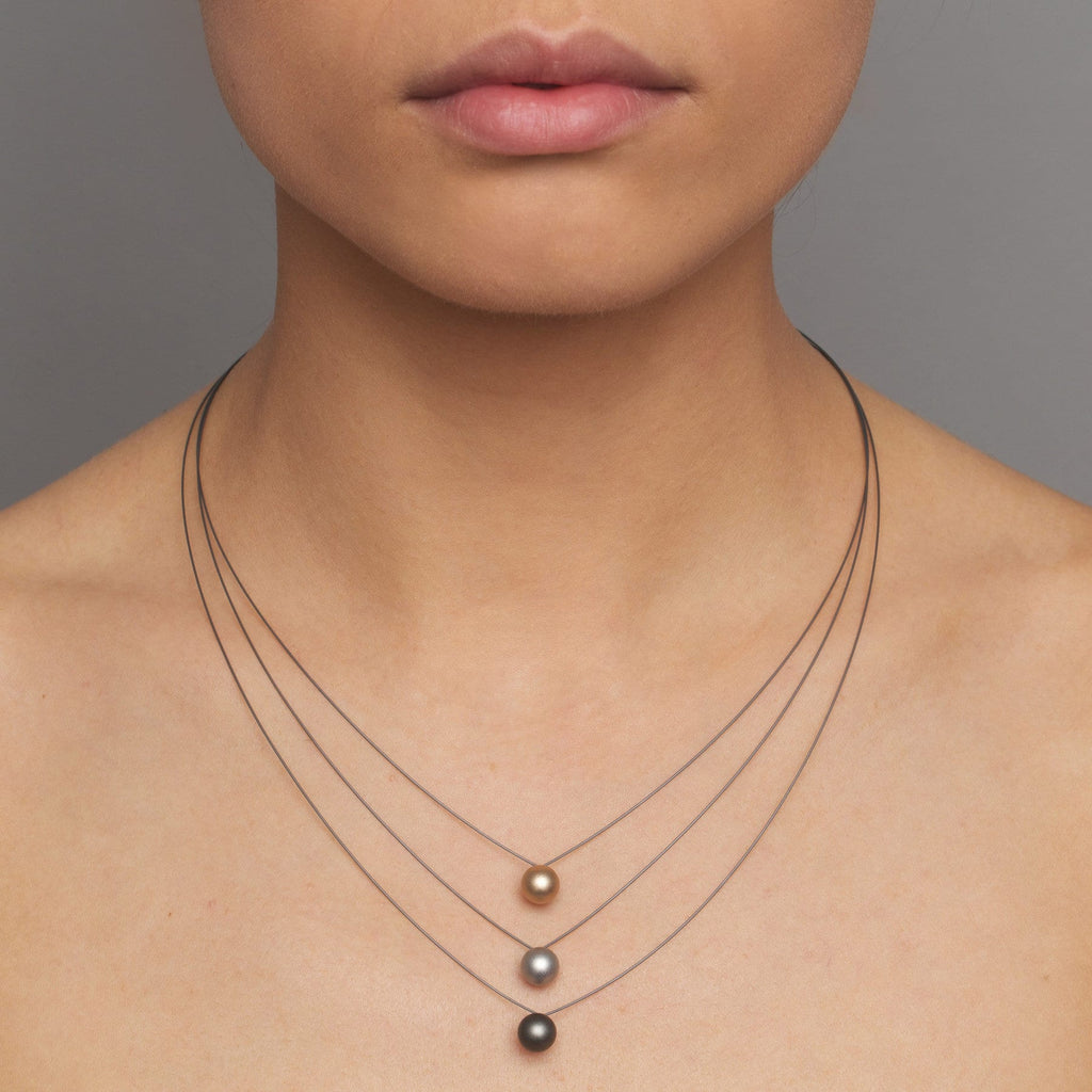 Photograph 2 of Ursula Muller's Contemporary 3 Strand Aluminium Bead Statement Necklace. Available on DESIGNYARD.com and in our Jewellery Shop Dublin, Ireland. Worldwide Shipping