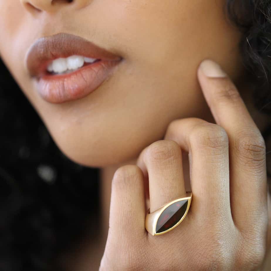 Photograph 3 of Angela Hubel's Contemporary 18k Rose Gold Garnet Navette Statement Ring. Available on DESIGNYARD.com and in our  Contemporary Jewellery Gallery Dublin, Ireland. Free Worldwide Shipping with DHL.