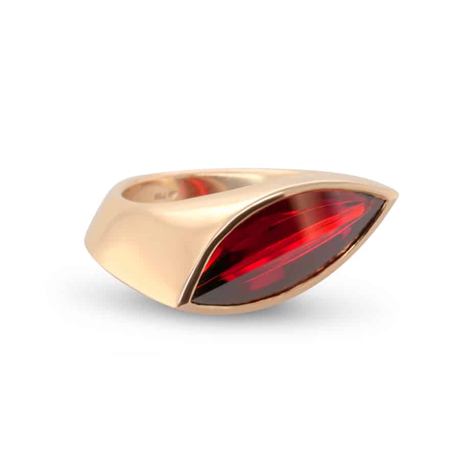 Photograph 1 of Angela Hubel's Contemporary 18k Rose Gold Garnet Navette Statement Ring. Available on DESIGNYARD.com and in our  Contemporary Jewellery Gallery Dublin, Ireland. Free Worldwide Shipping with DHL.