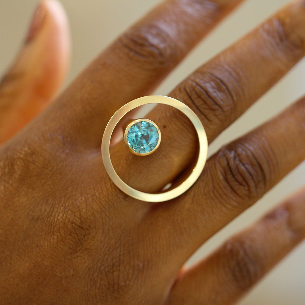 Photograph 6 of Angela Hubel's Contemporary 18k Rose Gold Treasure Island Blue Zircon Statement Ring. Available on DESIGNYARD.com No. 1 for Contemporary Jewellery Dublin, Ireland. Free Worldwide Shipping with DHL.