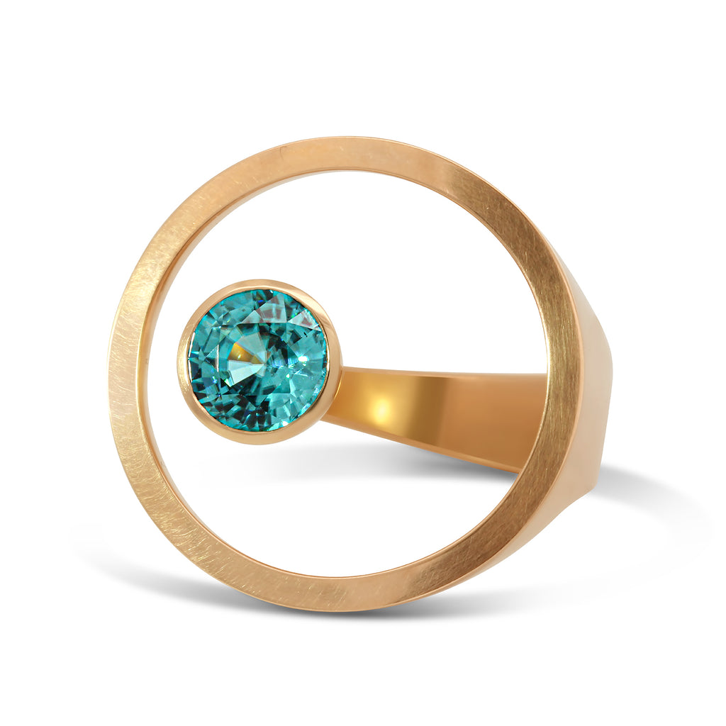 Photograph 1 of Angela Hubel's Contemporary 18k Rose Gold Treasure Island Blue Zircon Statement Ring. Available on DESIGNYARD.com No. 1 for Contemporary Jewellery Dublin, Ireland. Free Worldwide Shipping with DHL.