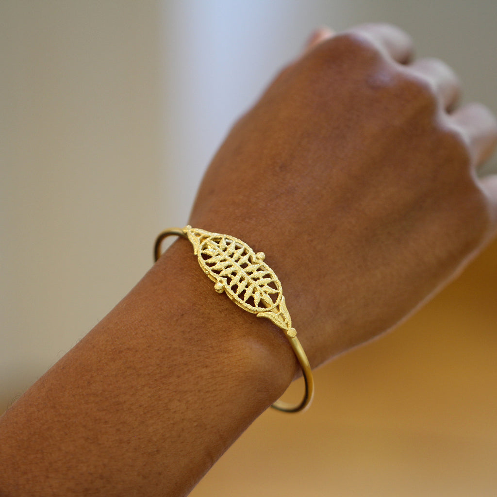 Photograph 3 of Brigitte Adolph's 18k Yellow Gold Adrienne Luxury Statement Bangle. Available on DESIGNYARD.com No 1 for Contemporary Jewellery Dublin, Ireland. Free Worldwide Shipping with DHL.