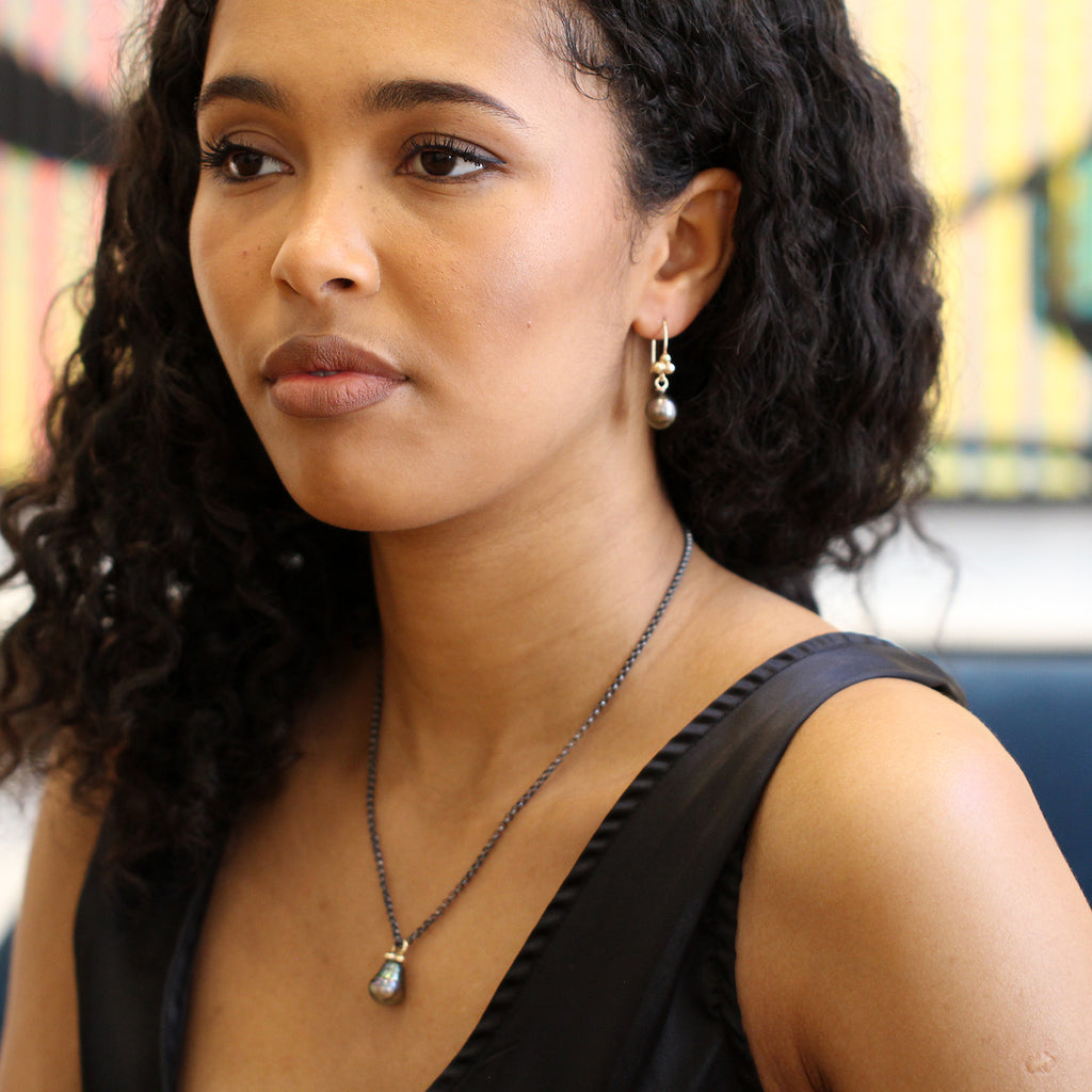 Photograph 2 of Cassie McCann's Irish Made Yellow Gold & Oxidised Silver Baroque Tahitian Pearl Pendant. Available on DESIGNYARD.com and in our Jewellery Shop Dublin, Ireland.