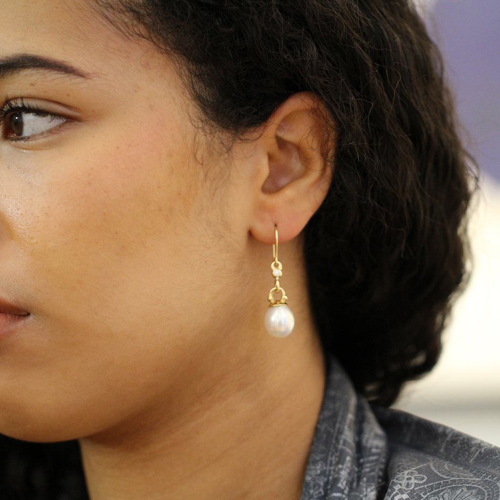 Photograph 3 of Cassie McCann's Contemporary 18k Yellow Gold elegant Pearl Diamond Athena Statement Earrings. Available on DESIGNYARD.com Number 1 for Contemporary Jewellery Dublin, Ireland. Free Worldwide Shipping with DHL.