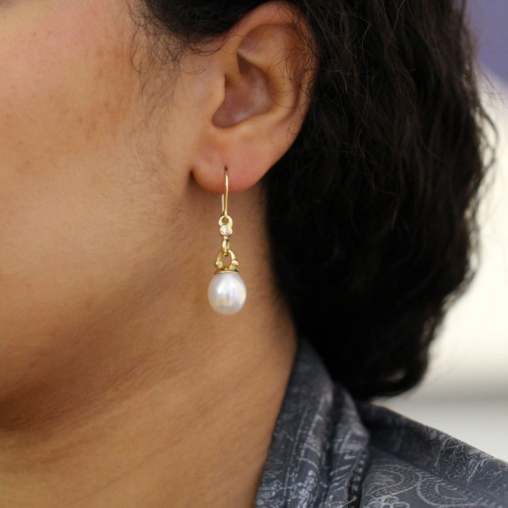 Photograph 2 of Cassie McCann's Contemporary 18k Yellow Gold elegant Pearl Diamond Athena Statement Earrings. Available on DESIGNYARD.com Number 1 for Contemporary Jewellery Dublin, Ireland. Free Worldwide Shipping with DHL.