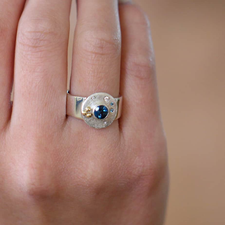 Photograph 2 of Cassie McCann's Contemporary Silver 18k Yellow Gold Blue Topaz Diamond Oceania Ring Irish made. Available on DESIGNYARD.com no 1 contemporary jewellery Dublin Ireland. Free Worldwide Shipping with DHL
