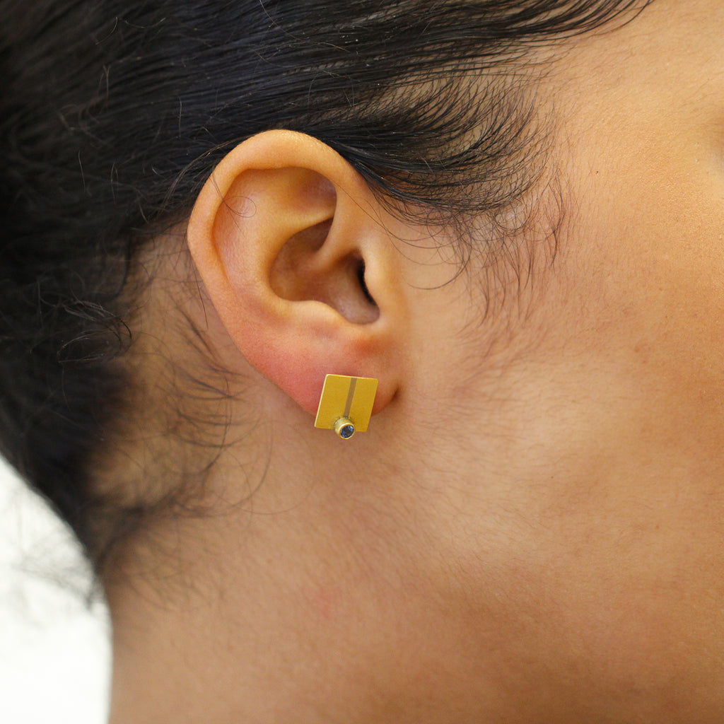 Photograph 2 of Catherine Mannheim's Contemporary 18k Yellow Gold Platinum Blue Sapphire Line Earrings, available on DESIGNYARD.com and in store Dublin Ireland. Free Worldwide Shipping with DHL.