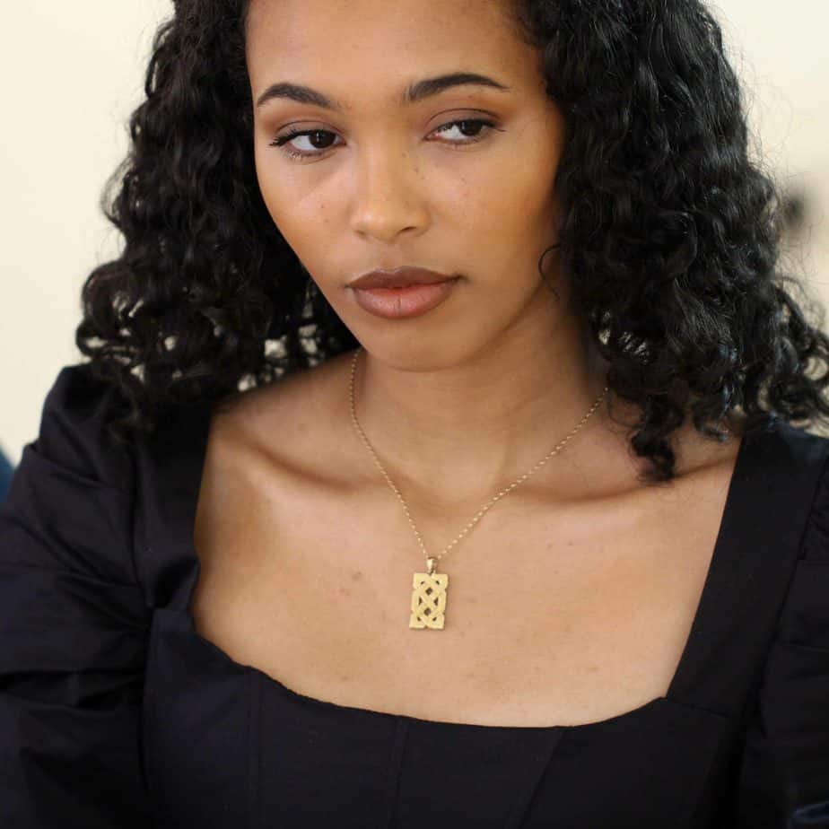 Photograph 2 of DesignYard's Irish Made 10k Yellow Gold Celtic Knot Ingot Pendant. Available on DESIGNYARD.com and in our Jewelry Store Dublin, Ireland. Free Worldwide Shipping with DHL.