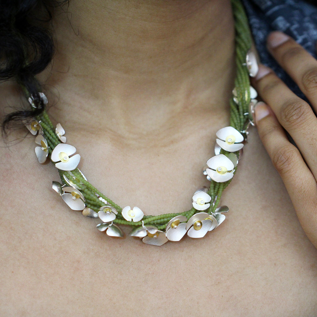 Photograph 2 of Inga Reed's Contemporary Silver 22k Yellow Gold Serpentine Orchid Statement Neckpiece. Available on DESIGNYARD.com and in our Jewelry Store Dublin, Ireland.