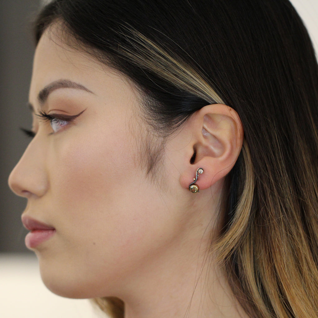 Photograph 2 of Josephine Bergsøe's Contemporary Silver & Yellow Gold Seafire Sapphire Single Earring. Available on DESIGNYARD.com and in our Jewellery Shop Dublin, Ireland. Free Worldwide Shipping with DHL.