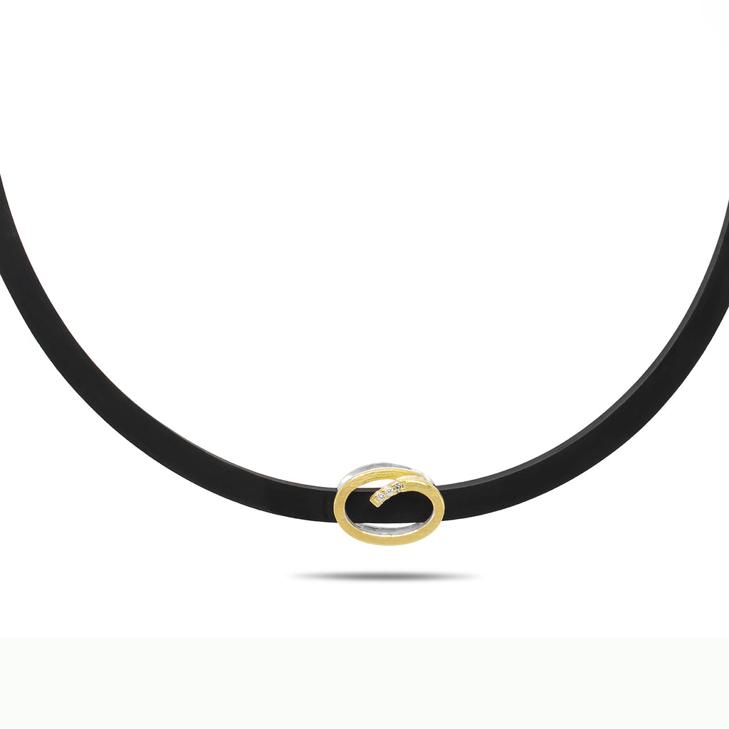 Photograph 1 of Manu's Contemporary Silver 22k Yellow Gold Swirls Diamond Rubber Necklace. Available on DESIGNYARD.com and in our Jewellery Shop Dublin, Ireland. Free Worldwide Shipping with DHL.
