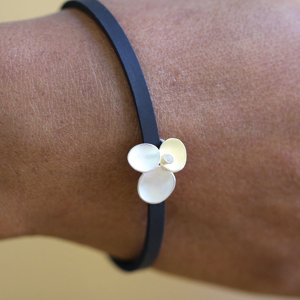 Photograph 2 of Manu's Contemporary Sterling Silver & 22k Yellow Gold Trillium Diamond Rubber Bracelet. Available on DESIGNYARD.com and in our Jewellery Shop Dublin, Ireland. Free Worldwide Shipping with DHL.