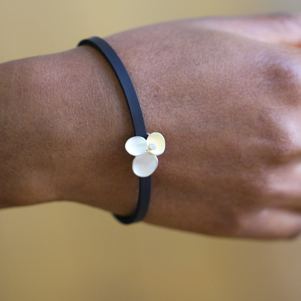 Photograph 5 of Manu's Contemporary Sterling Silver & 22k Yellow Gold Trillium Diamond Rubber Bracelet. Available on DESIGNYARD.com and in our Jewellery Shop Dublin, Ireland. Free Worldwide Shipping with DHL.