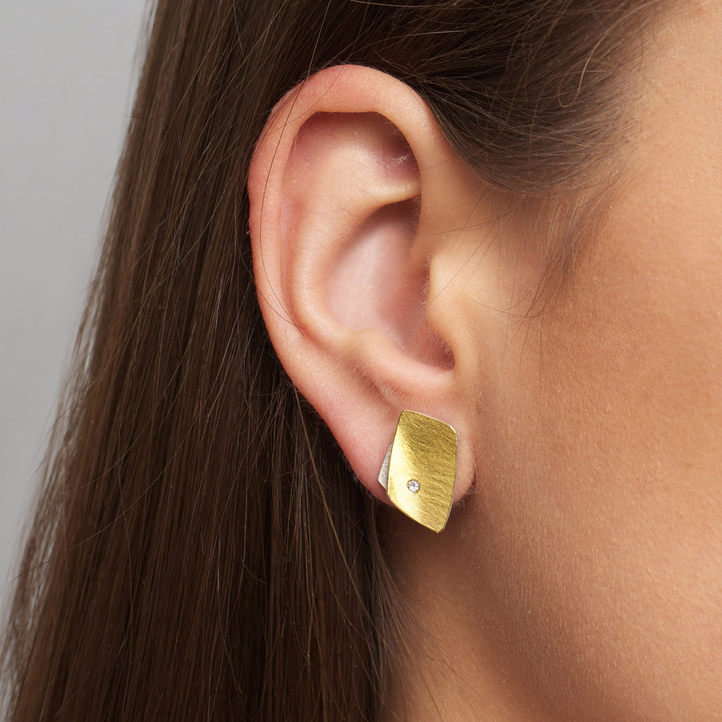 Photograph 2 of Manu's Contemporary Sterling Silver 22k Yellow Gold Textured Diamond Stud Earrings. Available on DESIGNYARD.com and in our Jewellery Shop Dublin, Ireland. Free Worldwide Shipping with DHL.